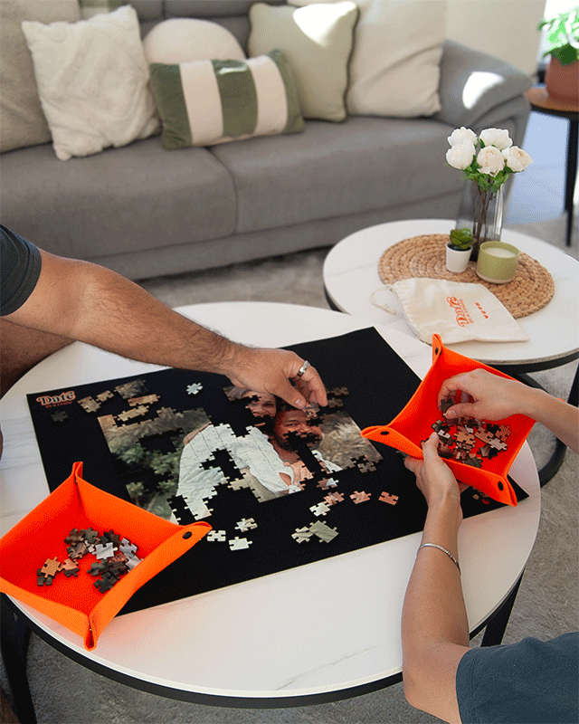 Couple enjoying a Date in a Crate custom puzzle crate, a fun at-home date night activity.