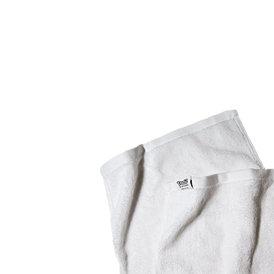 Soft white spa towel with Date in a Crate branded tag.