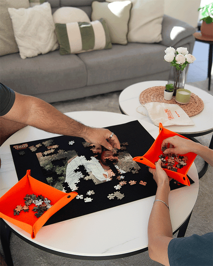 Couple enjoying a Date in a Crate custom puzzle crate, a fun at-home date night activity.